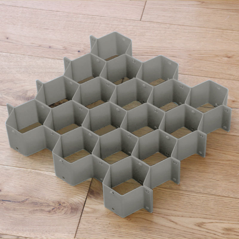 Séparateur de tiroir alvéolé gris, casiers hexagonaux assemblés