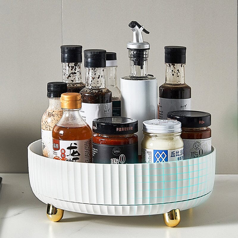 Plateau tournant de rangement rond blanc avec rebord surélevé, posé sur un plan de travail de cuisine