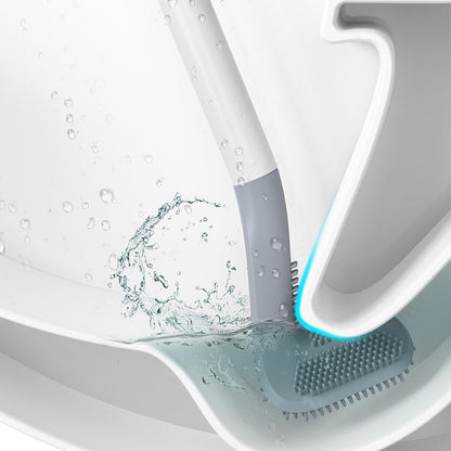 Support adhésif de la brosse WC fixé derrière la cuvette