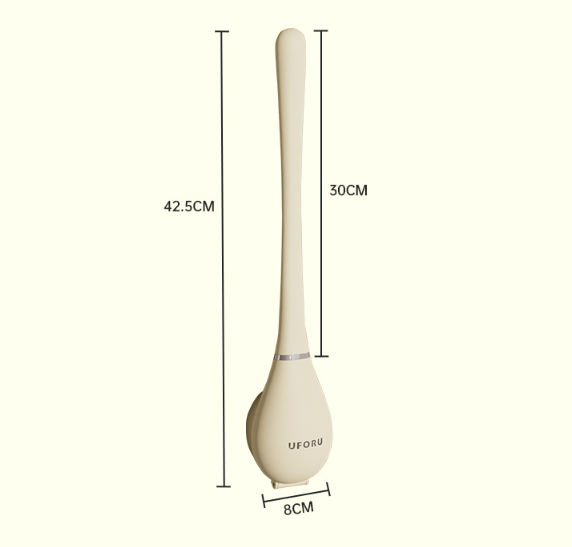 Brosse WC en silicone rangée dans son support à côté des toilettes