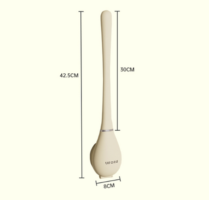 Brosse WC en silicone rangée dans son support à côté des toilettes