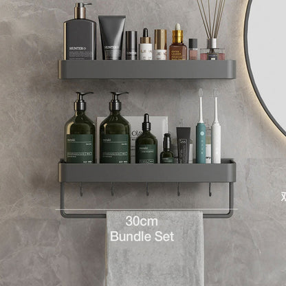 Étagère murale grise avec porte-serviettes intégré, installée sur un mur carrelé