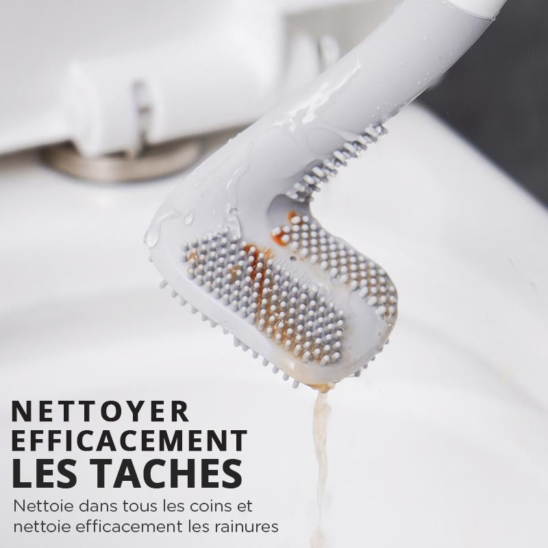 Brosse WC noire fixée au mur à côté de la cuvette