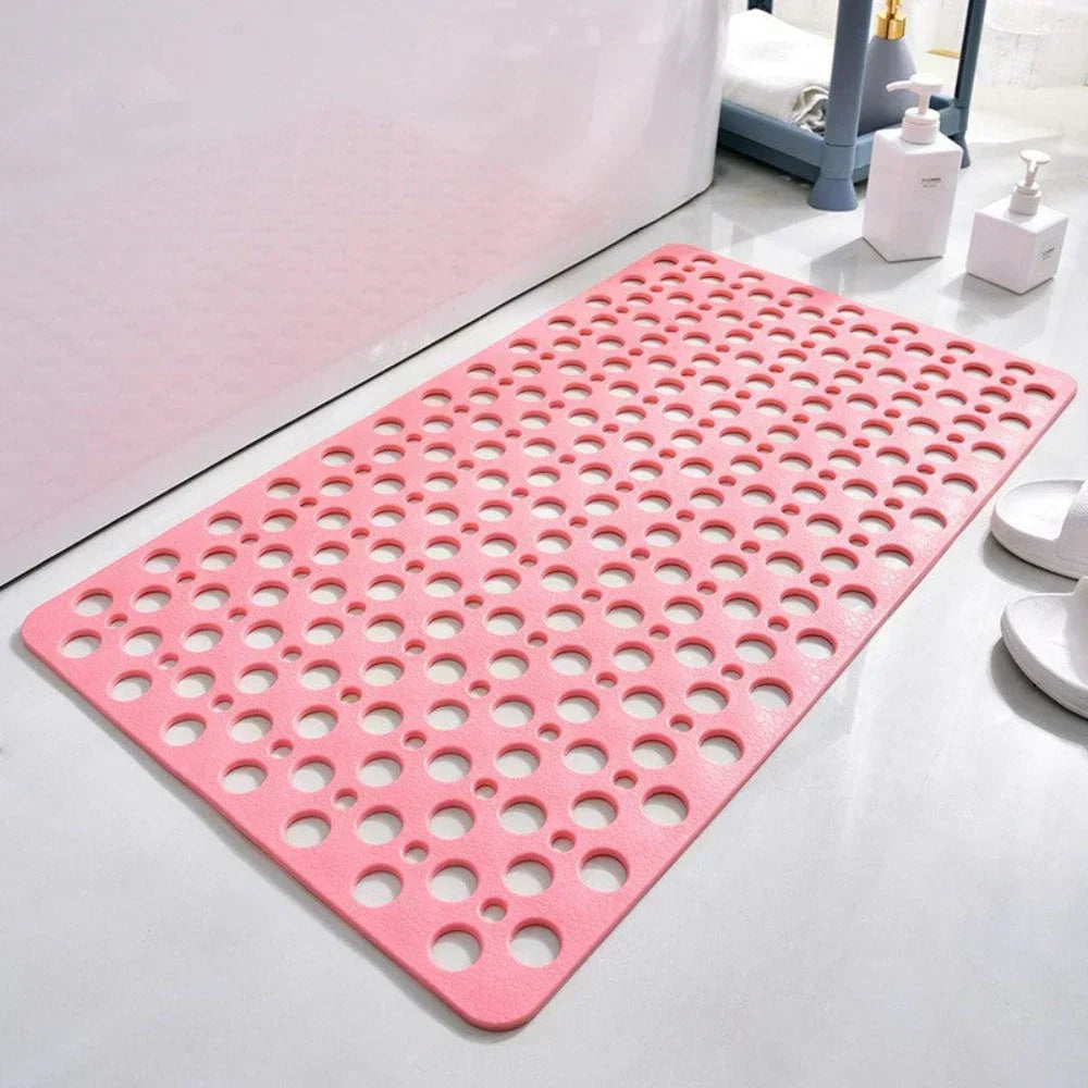 Tapis de douche antidérapant rose avec trous d'évacuation ronds