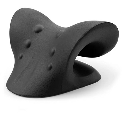 Coussin d'étirement cervical noir posé sur un tapis