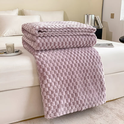Couverture en microfibre sur un lit avec coussins