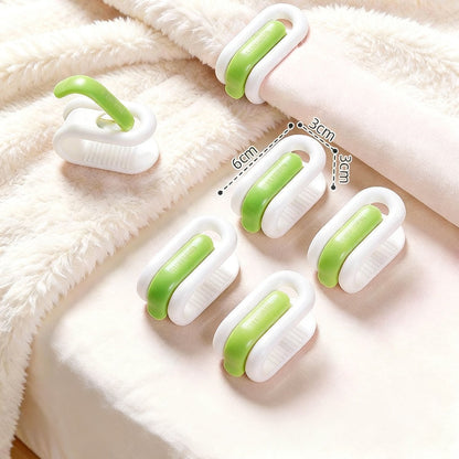 Pinces à couette coloris vert et blanc sans aiguille pour maintenir la couette