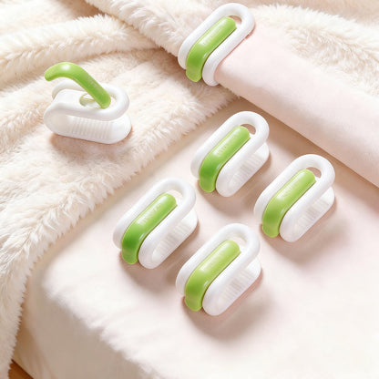 Pinces à couette coloris vert et blanc sans aiguille pour maintenir la couette