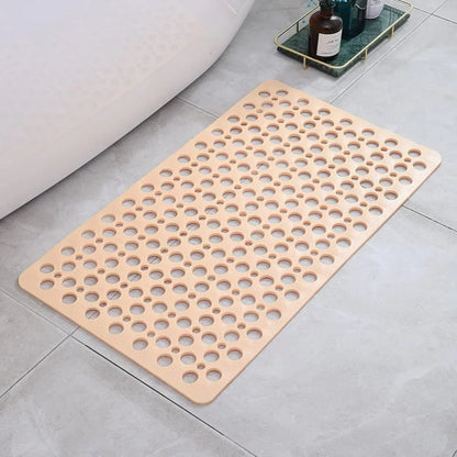 Tapis de douche antidérapant beige avec trous d'évacuation ronds