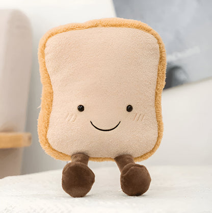 Coussin en peluche en forme de baguette de 32 cm, allongé sur un canapé