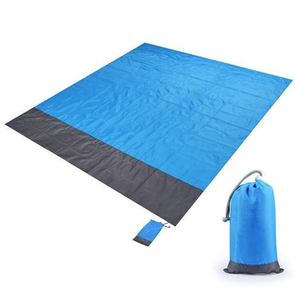 Coin de la couverture de plage anti-sable avec son œillet de fixation